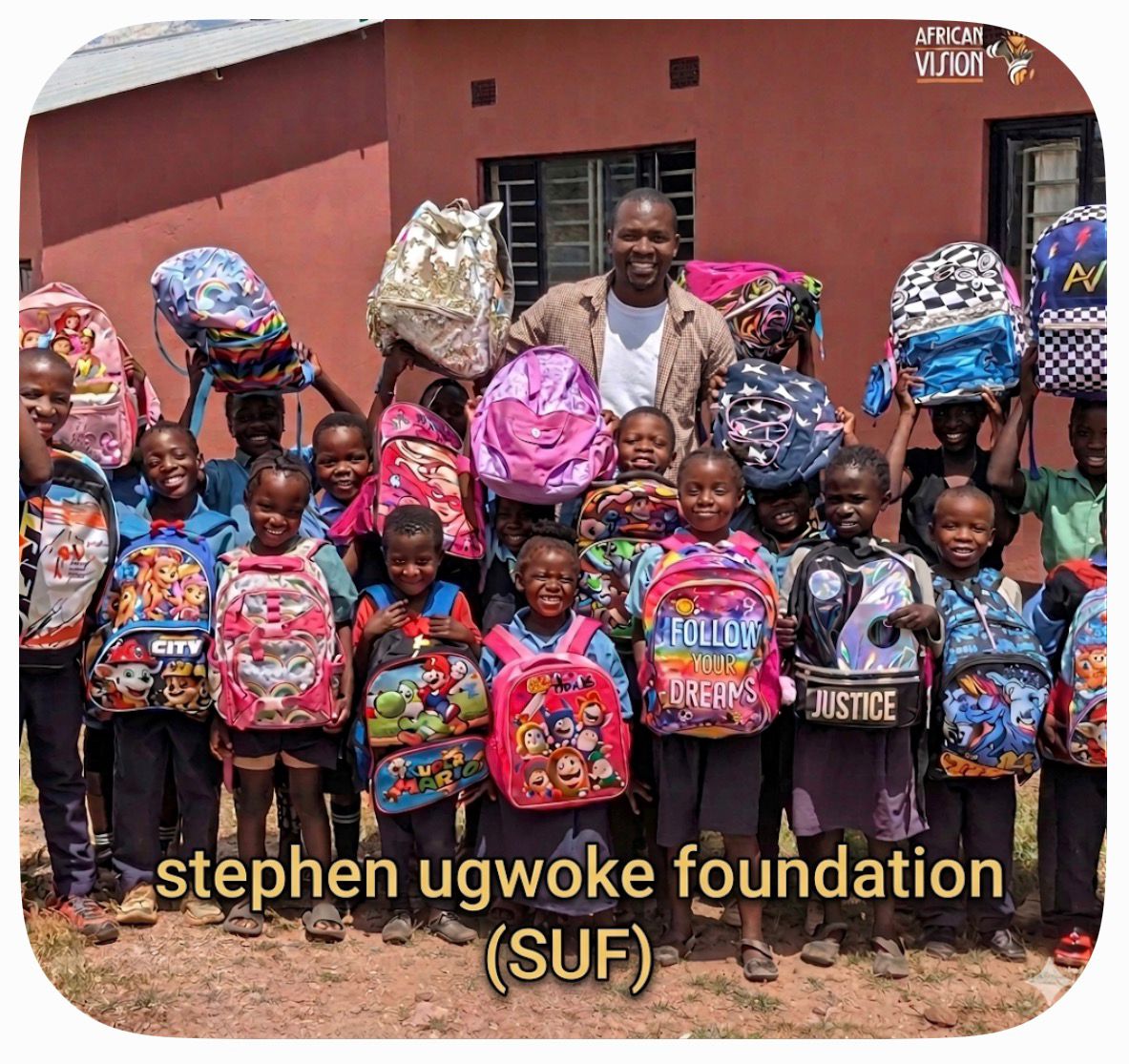 Children receiving school backpacks from SUF